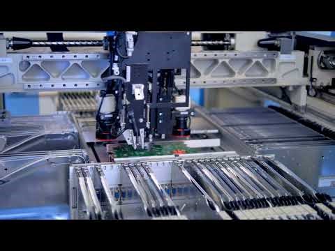 VideoVault Stock Video: Robot that assembles small components on a circuit board