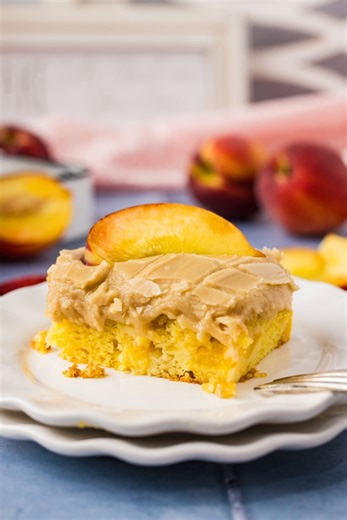 4.6K views · 18 reactions | This gorgeous brown sugar peach cake is made with a simple cake mix that’s dotted with fresh juicy peaches and topped with a caramelized brown sugar icing. Swoon. #brownsugarpeachcake #peach #peachrecipes https://amandascookin.com/brown-sugar-peach-cake/ | Things I Love | Facebook