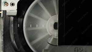 Extreme close up rewind of VHS old vintage tape cassette. retro VCR player. Old vintage tape on the video, audio tape recorder or player. Close up.