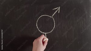 Gender equality sign is drawn on a chalkboard, timelapse. Gender equality sign is drawn on the blackboard with a hand and chalk.