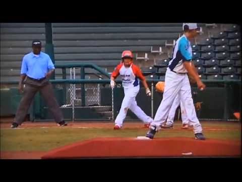 Smart 10-year-old pitcher picks off runner at 1st base.