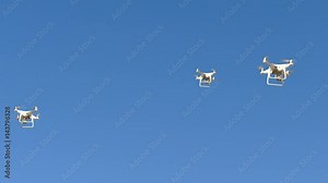 Hectic swarm of Drones flying everywhere in the sky, seamless loop. This blue sky can be chroma keyed so that you can place these drones in another sky or setting with ease.