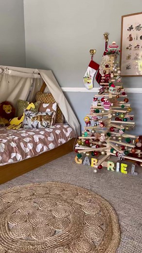 Gabriel’s tree from @onetwotree_ is up! I love the fact that this tree is eco friendly 🤍.I love the fact that I can use this tree every year and simply change the colour scheme without making a big tree mess in his room.These @onetwotree_ tree’s are hand crafted and made from sustainable plywood. You guys, doesn’t it suit his room so much 🥰? scandi wool Rug @templeandwebster Wooden letters @kmartaus (I hand painted them to match the theme.Tiger cushion from house Australia Tiger, lion, monkey 