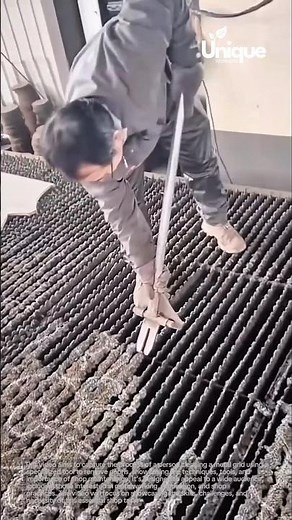 Cleaning metal grid: removing debris with a tool