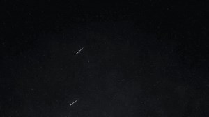 Spectacular Meteor Streaking Across a Star-Filled Night Sky. Shooting Star. 4K