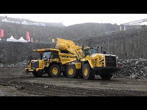 Komatsu WA 600-8 wheel loader loads HD 605-8 dumptruck