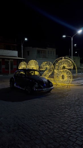 A Volkswagen Beetle decorated for Christmas with flashing lights