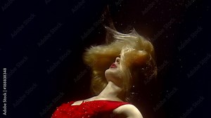 Incredible woman dancing underwater.