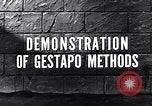 1945 – Munster Germany: Demonstration of atrocity and torture at Munster concentration camp during World War II, by the survivors of the camp.