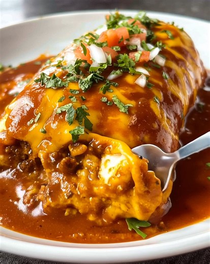 Cheesy, saucy, and totally satisfying 🌯🔥 This Ground Beef Wet Burrito is loaded with seasoned beef, smothered in rich sauce, and baked to gooey perfection 😋 .............. Full Recipe in Coʍmеոτ 💬🍴👇 | Donerecipe by Sarah