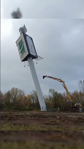Watch an Advertising Tower Get Demolished by Excavator in Seconds! #demolition #excavator