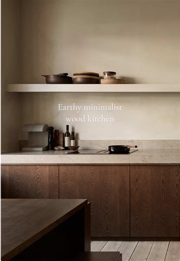 Simplicity and earthy tones come together in this Scandinavian kitchen, creating a serene and calming space. #kitchenstyle #earthyaesthetic #woodkitchen #minimaliststyle #scandinavianinterior