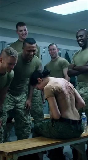 “The Soldiers Laughed at the Young Woman’s Scars in the Locker Room — Until the General Revealed a Truth That Left Them Frozen” 😲 The soldiers thought it was funny when they saw the young woman’s scars. They laughed, they mocked, and they whispered cruel jokes—until the general himself walked in. What he revealed next shook every man in the room to his core. 😱😱 At the military base, where only men had served for years, the arrival of a woman created a storm of reactions. Instead of respect, s