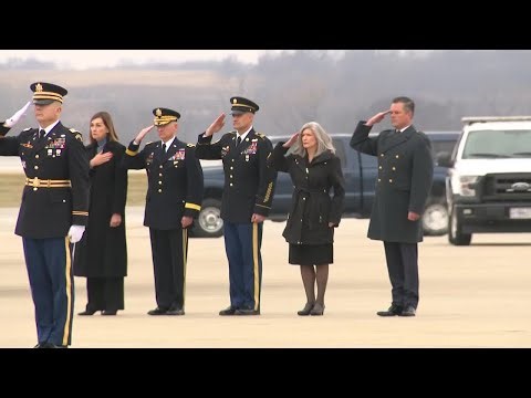 Bodies of slain Iowa soldiers loaded into hearses at Des Moines airport