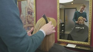 Barber combing blonde hair - Free Stock Video