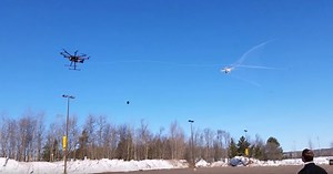 Drone-catching hexacopter fires a large net to reel in suspicious aircraft