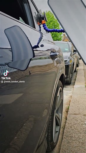 Audi Q4 nearside rear door paintless dent repair.