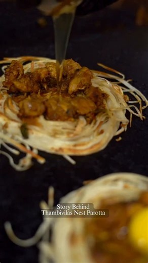 ThambiVilas on Instagram: "When flaky Madurai parotta meets bold Malaysian flavours. Our Nest Parotta is crafted like a bird’s nest, crisp outside, rich and comforting inside. A street classic, elevated the Thambivilas way. [Chennai food, Tamil Nadu cuisine, Nest Parotta, Parotta lovers, South Indian street food, Chennai street food, Thambivilas special, Authentic Tamil food, Crispy parotta, Mutton chukka, Chicken chukka, Tamil food culture, Chennai restaurants, Traditional Tamil cuisine, Food r