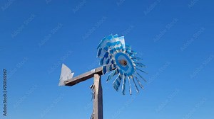 wind Wheel, WIND ENGINE - a device that converts wind energy into the energy of rotational motion. The main working part of a wind turbine is a rotating wheel driven by the wind.