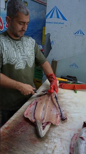 Watch This Fishmonger Fillet a Fish Faster Than Lightning!