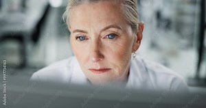 Mature, scientist and reading with computer in lab for experiment data, digital innovation and research documentation. Woman, online and thinking for science, medical analysis and biotech results Stock Video