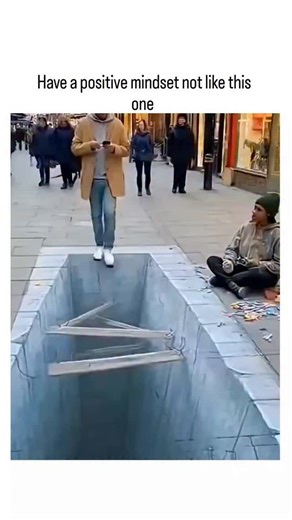 buzz__decode on Instagram: "The post features a 58-second compilation video of pedestrians reacting fearfully to 3D chalk illusions of sidewalk pits and chasms, used to contrast negative fear responses with the benefits of a positive mindset for handling perceived threats. Posted on January 1, 2026, by motivational influencer @Erikr250 , it aligns with New Year's themes of mental health and optimism, garnering over 888,000 views and sparking replies debating AI generation versus real street art.