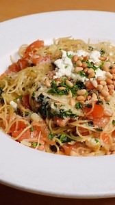 Our Angel Hair Pasta made with garlic, tomato, pine nuts, extra virgin olive oil, basil, Parmesan & feta cheese. #angelhairpasta #pasta #finedining #orangecounty #wine #ocfood | Zov's Restaurants