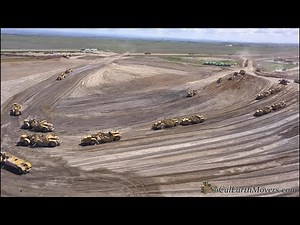 Digging new landfill cell with fleet of Caterpillar scrapers (Part 2)