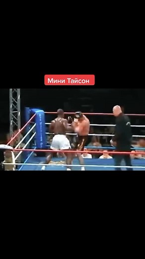 Intense Boxing Match: Black vs. White Trunks Fight