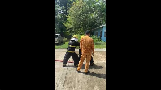 Youngster knocked over by the force of fire hose in training exercise