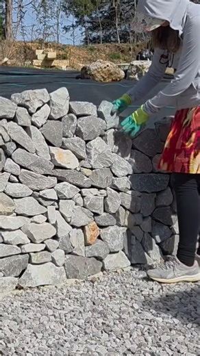 Placing Stone on Retaining Wall Riprap Limestone
