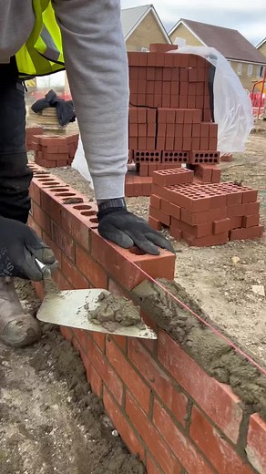Bricklaying Expert Completing a Challenging Hump with Precision