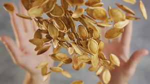 Throwing pumpkin seeds in slow motion