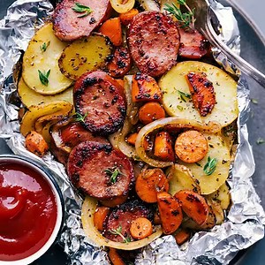 463K views · 2.9K reactions | A twist on classic HOBO FOIL PACKETS using sausage instead of ground beef. We’ve got the classic carrots, onions, and thinly sliced potatoes. A truly comforting, filling, and hearty meal that’s great for a no-mess meal or campfire dinner! RECIPE: https://www.chelseasmessyapron.com/hobo-foil-packets/ | Chelsea's Messy Apron | Facebook