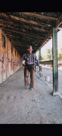 Traditional Cowboy Dance Performance in Rustic Setting
