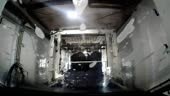 Car dashboard camera point of view going through an automated car wash