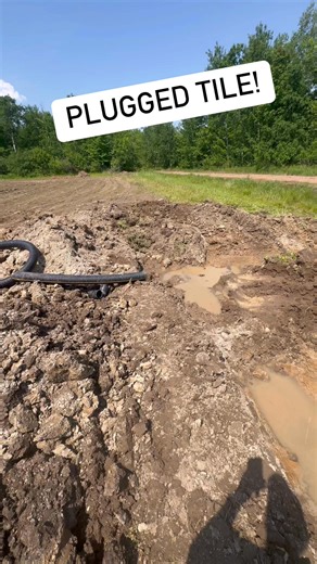 Fixing plugged field tiles. Good work Russ! #tile #farming #agriculture | The Digital Farmer