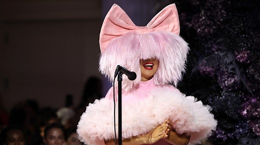 The Sad Reason Why Sia Started Wearing Wigs To Perform - The List