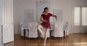 beautiful teenage ballerina girl dancing practicing ballet dance moves playfully rehearsing at home 4k