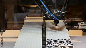 Robot arm places words from letters on a conveyor belt with model driven integrated smart software