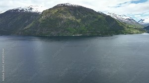 Ferry connection Eidsdal to Linge for travellers to Geiranger in Norway - Aerial flying above fjord looking towards Linge ferry pier Stock Video