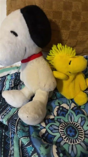 Snoopy and Woodstock are dancing together