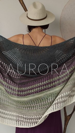 Cast On the Inspired Aurora Pattern – A Crocheted Shawl that Will Wrap You in Elegance! Download Aurora at www.expressionfiberarts.com. Aurora is made with our Luster Sport yarn, which is a beautifully shimmering and soft, sport-weight yarn with a squish factor that is sure to please! Everyone who sees and feels this yarn base LOVES it. Luster Sport is a blend of 50% Superwash Merino Wool and 50% Lyocell with 395 yds/361 m per skein. Shop all of our Luster Sport yarn at www.expressionfiberarts.c