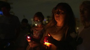 Hundreds attend vigil for condo collapse victims as rescue efforts continue