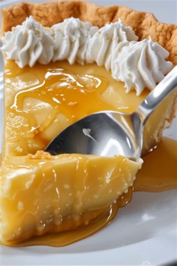 the golden sweetness of this delightful Honey Pie! 🍯🥧 With a luscious, smooth honey filling encased in a flaky, buttery crust, this pie is a true testament to simple, comforting flavors. Drizzled with extra honey and topped with a cloud of whipped cream, it's a wonderfully sweet treat that will bring warmth to any occasion! #HoneyPie #SweetPie #DessertPie #HoneyDessert #EasyPie #HomemadePie #ComfortFood #SweetTreats #ClassicDessert #BakingLove #DeliciousRecipe #HomeBaked #PieRecipe #GoldenHone