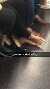 Woman has bare feet out on train