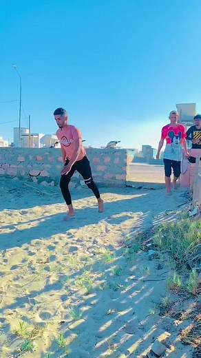 Acrobatic Beach Performance: Stunning Moves on Sand
