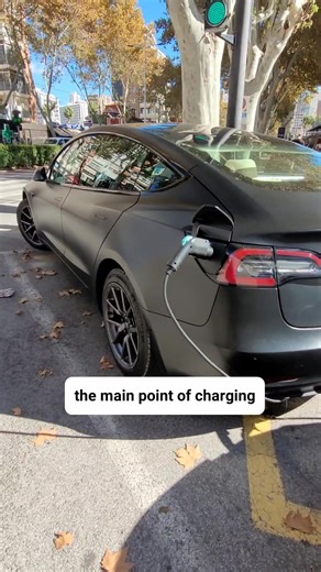 electric car (EV) being charged at a public roadside charging station,, #cars #teslachallenge #renault #spainlife #lifestyle #Mizo #autumnvibes #streetphotography | Dini Still Mizo