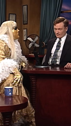 ⭐️💛 GOLDUST 💛⭐️ Goldust showing up on Late Night with Conan O’Brien and immediately putting the RIZZ on BOTH Conan and Andy while Marlena smoked in the background like a Bond villain is PEAK ‘90s wrestling promotion. Dust was cutting a promo for Roddy Piper and simultaneously emotionally scarring two comedians. Absolute art. #thestunner #rockandwrestling #wwe #wwf #prowrestling #wrestlemania #goldust #dustinrhodes #roddypiper #conanobrien #shattereddreams | The Stunner