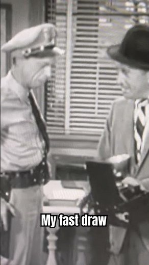 The Andy Griffith Show: Barney ask the photographer about his camera because his draw is so fast